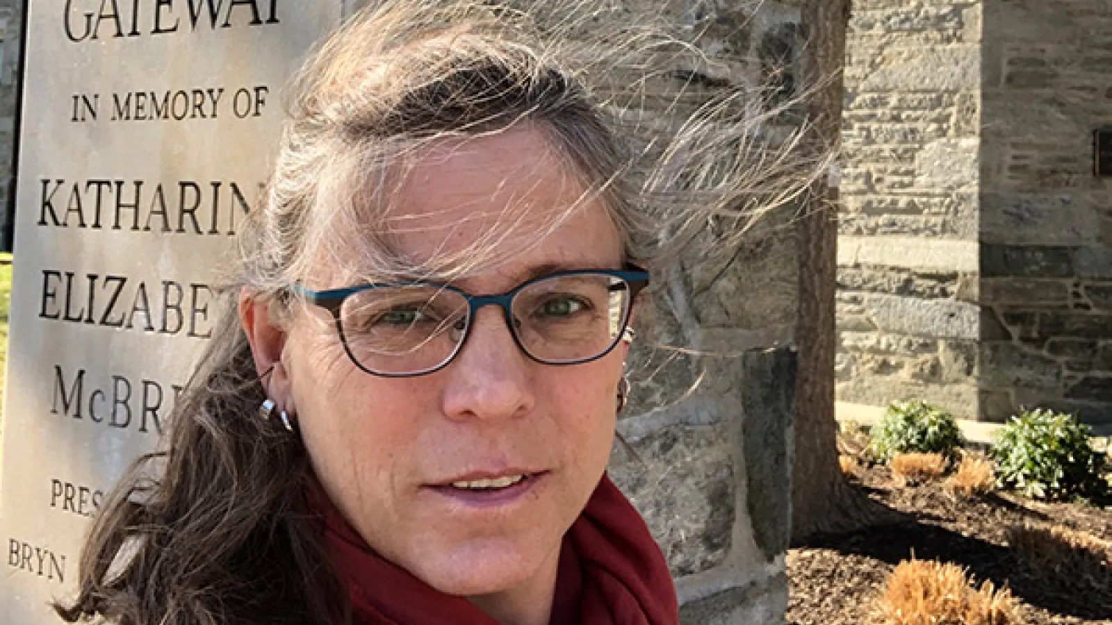 Angela Brintlinger standing by McBride Gateway