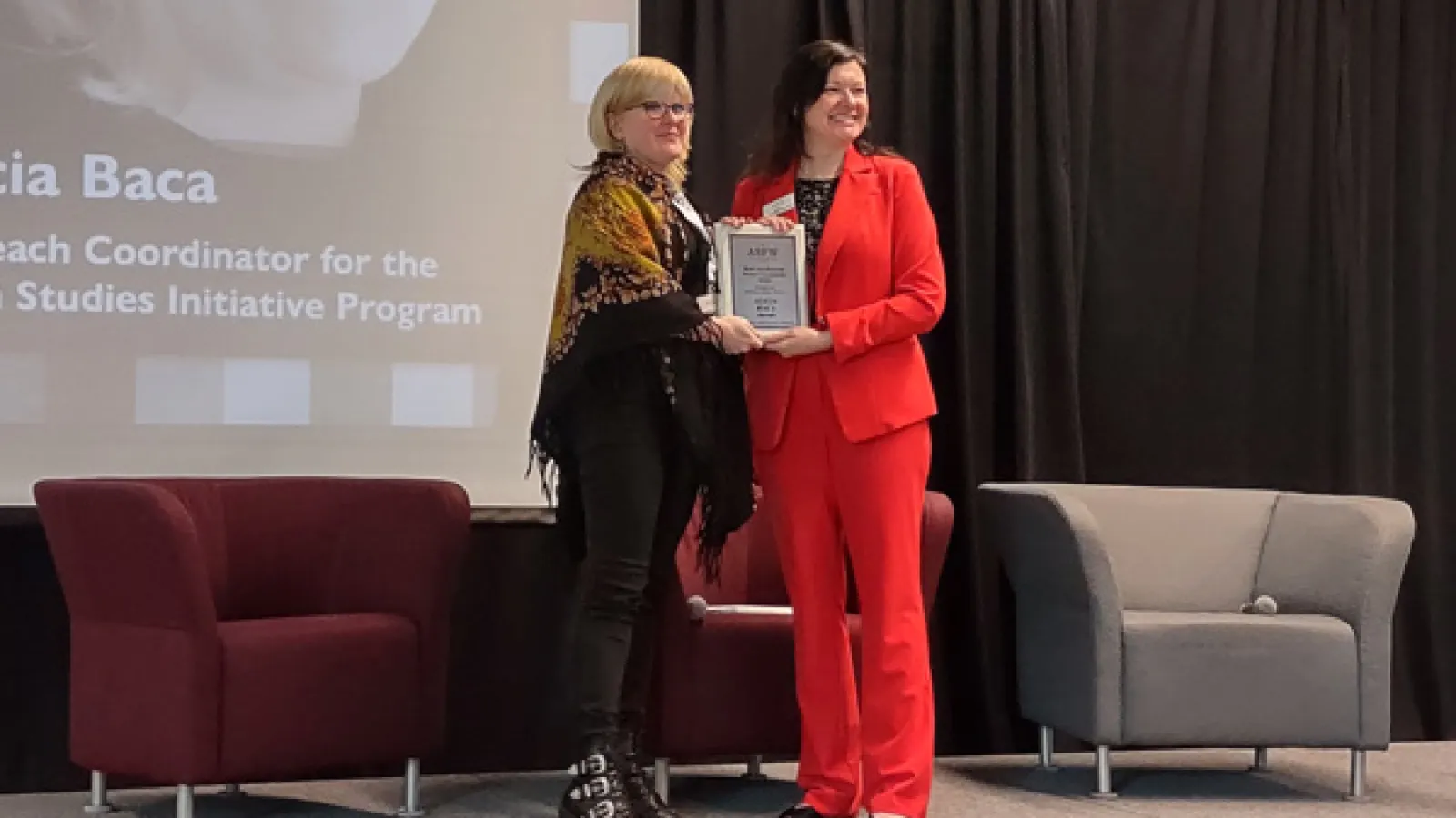 Alicia Baca receiving award from ASFW president, Elaine McLoughlin-Overholt 