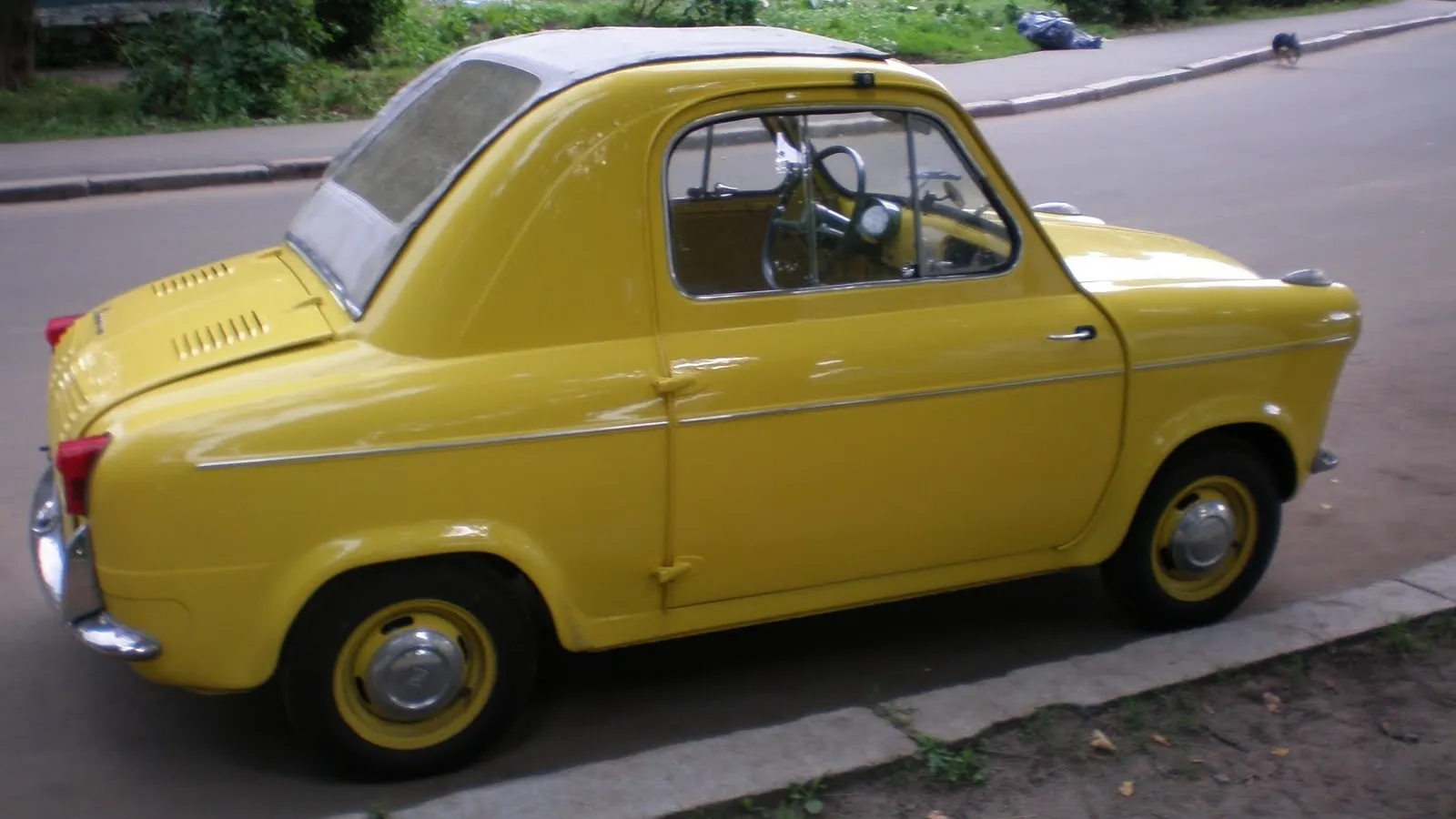 Bright yellow, two seater older car