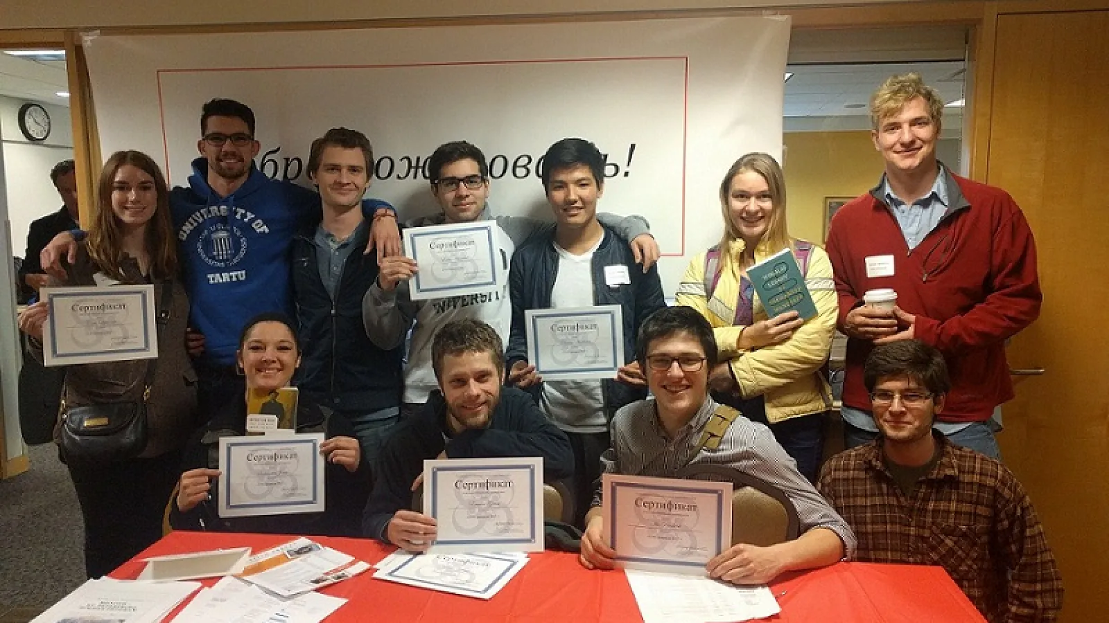 Olympiada competitors with their certificates of completion