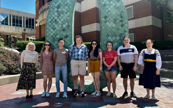 CSEEES MA students in front of the Oxley number statues
